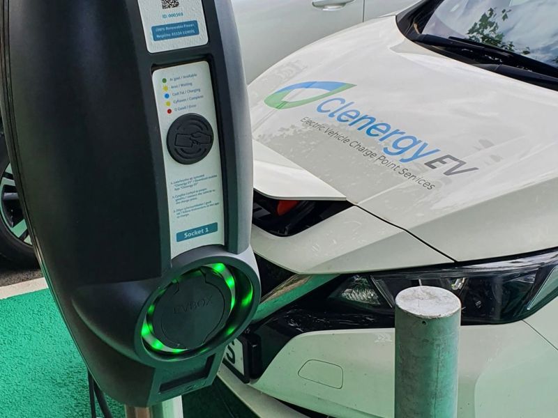 EV Box charging robot plugged into a Clenergy EV vehicle